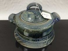 Jane Hamlyn (born 1940): A salt glazed casserole dish, in blue/green glaze, with incised decoration,