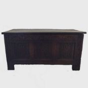 An eighteenth century carved oak blanket chest or coffer,