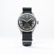 A GENTLEMAN'S STAINLESS STEEL BRITISH MILITARY W.W.W. CYMA WRIST WATCH CIRCA 1940s 
D: Black dial