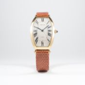 A FINE GENTLEMAN'S 18K SOLID GOLD CARTIER TONNEAU XL WRIST WATCH CIRCA 1990s 
D: Silver guilloche