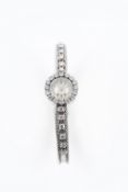 A FINE LADIES 18K SOLID WHITE GOLD & DIAMOND JAEGER LECOULTRE BRACELET WATCH CIRCA 1960s 
D: