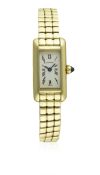A LADIES 18K SOLID YELLOW GOLD CARTIER MINI TANK ALLONGEE BRACELET WATCH CIRCA 1990, REF. 28006 D: