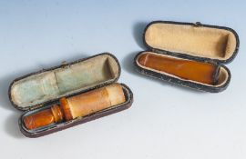 2 Zigarrenspitzen, 19. Jahrhundert/ um 1900, Bernstein, geschnitzt, 1 x m. Meerschaum,gebrauchter