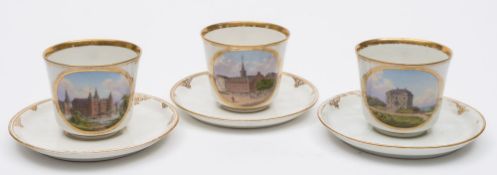 Three Royal Copenhagen porcelain cups and saucers: each cup painted with an oval topographical