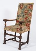 A late 17th Century carved walnut open armchair:, with a rectangular stuff over back and seat,