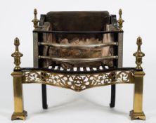 A 19th century iron and brass fire basket: of serpentine outline,