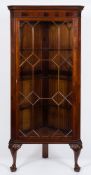 An Edwardian mahogany standing corner display cabinet:, in the Georgian taste,