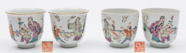 Four Chinese porcelain famille rose wine cups: comprising a pair of mildly flaring ribbed cups