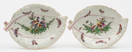 A pair of large Worcester cabbage leaf dishes: painted with fancy birds,