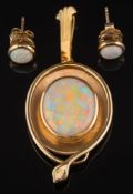 An oval opal, single stone pendant: the opal approximately 17mm long x 14mm wide,