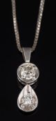 A diamond two stone pendant: with circular brilliant-cut diamond approximately 0.