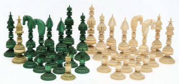 A 19th century Indian 'Pepys' type ivory chess set: one side stained green,