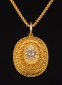 A Victorian gold and diamond set oval,