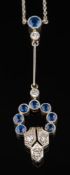 A sapphire and diamond lavalier: with circular openwork cluster of round sapphires and single-cut