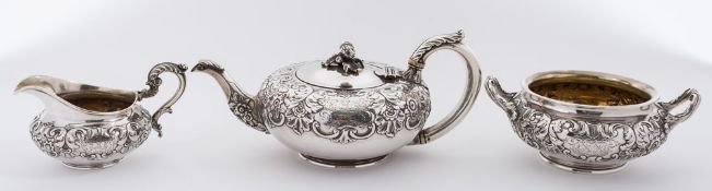 A William IV silver three-piece tea service, maker Robert Hennell II, London, 1931: crested,