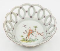 A Worcester polychrome pierced basket: the interior and exterior applied and painted with florets,