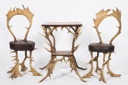 An unusual pair of 'Antler' chairs and table from Schloss Georgium:,