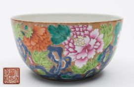 A Chinese porcelain bowl: decorated in the famille rose palette, the exterior with chrysanthemum,