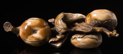 A Japanese ivory okimono: Meiji period (1864-1912) carved in the form of cob nuts, signed 10cm.