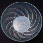 A Lalique bowl 'Poissons': the mildly opalescent body intaglio decorated to the exterior with a