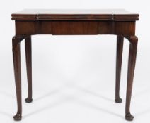 A George II mahogany tea table:, the rectangular hinged top with projecting corners,