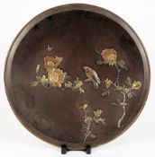 A Japanese inlaid and gilded bronze circular charger: decorated with a finch and bee amongst