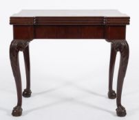 A 19th Century carved mahogany triple top games and tea table in the George II taste:,