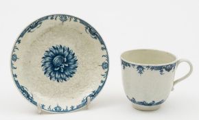 A Worcester blue and white moulded chrysanthemum pattern cup and saucer: moulded and painted with