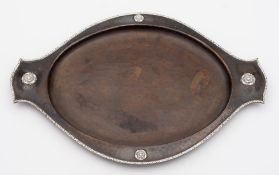 An Arts and Crafts beaten copper and silver applied tray: of oval outline,
