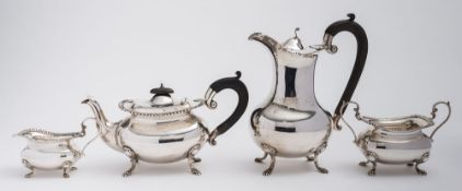 A matched silver four-piece tea service, maker Walker and Hall, Birmingham, 1917/18,