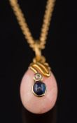 A sapphire and diamond mounted egg-shaped pendant: on chain.