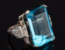 An art deco-style white metal,