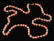 A coral bead and cultured pearl single string necklace: with beads ranging 6.5mm diameter to 7.