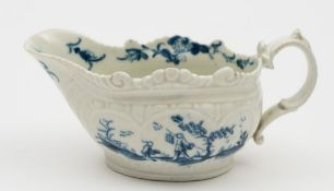 A small Worcester blue and white sauceboat: of squat form with double scroll handle,