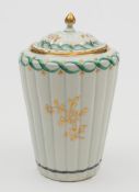 A Worcester tea canister and cover: of reeded tapering cylindrical form with pointed finial,