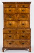 An early 18th Century walnut veneer fronted chest on chest:, with stained pine sides,