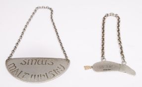 An Elizabeth II silver spirit label, maker KE, Edinburgh,