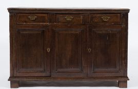 An 18th Century oak rectangular dresser base:, the top with a moulded edge,