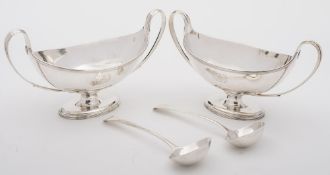 A pair of George III silver sauce tureens, maker Henry Chawner, London, 1787: crested,