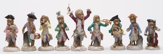 A set of nine Dresden porcelain monkey band musician figures: after the Meissen originals,