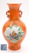 A Chinese famille rose orange ground vase: of baluster form with pierced dragon handles,
