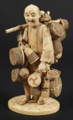 A Japanese carved ivory okimono of a basket seller: wearing traditional peasant costume with