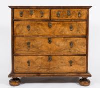 An early 18th Century walnut veneer and feather banded rectangular chest:,