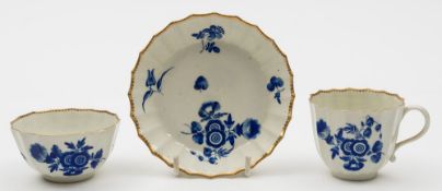 A Worcester trio: of fluted form painted in dry blue with floral sprays and foliage, seal marks,