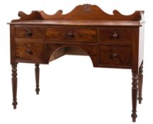 An early 19th Century mahogany rectangular washstand:, with a shaped three quarter ledge back,
