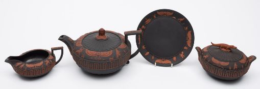 A fine Wedgwood rosso antico 'Egyptian' part tea service: applied in red terracotta on a black