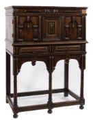 An 18th Century French walnut cabinet on a later stand:,