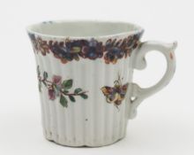 An early Worcester coffee can: of ribbed form with scroll handle,