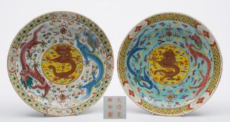 Two Chinese famille rose 'dragon' medallion dishes: painted in bright enamels with dragons chasing
