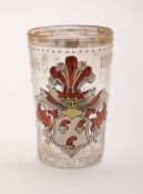 A German enamelled glass armorial tumbler, dated 1594: with gilt rim,